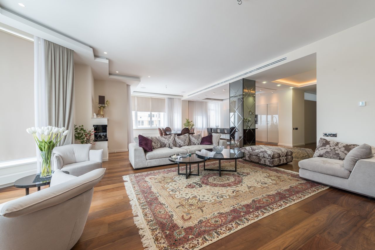 Bright living room with elegant seating and large windows